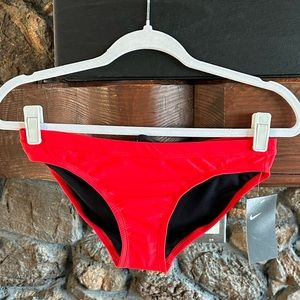 Nike swim bottoms with drawstring and sanitary pad still on, never worn